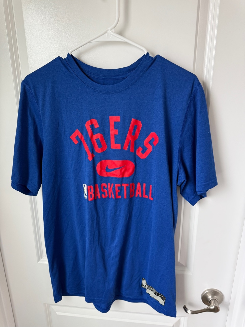 Nike Blue Short Sleeve Tee with Red 76ERS Basketball Graphic